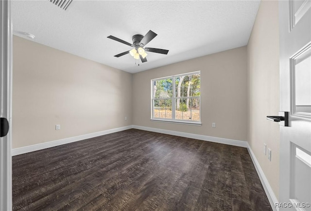 empty room with dark wood-type flooring, a textured ceiling, and ceiling fan