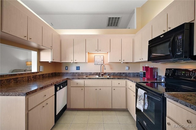 kitchen with visible vents, a sink, dark countertops, black appliances, and light tile patterned flooring