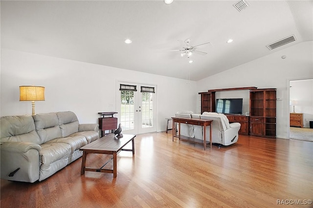 living room featuring french doors, lofted ceiling, a ceiling fan, and visible vents