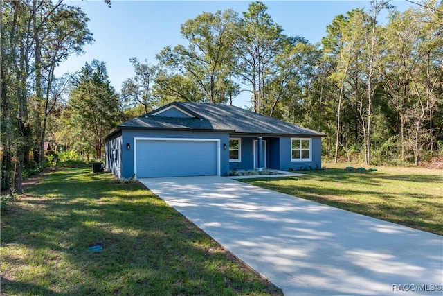 ranch-style home with a front yard and a garage