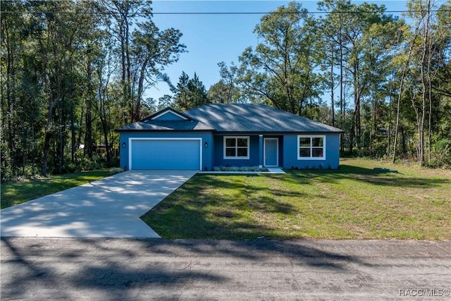 single story home featuring a garage and a front yard