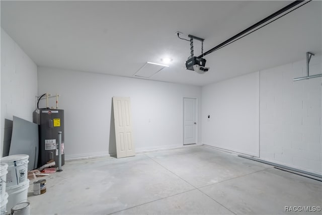 garage featuring electric water heater and a garage door opener