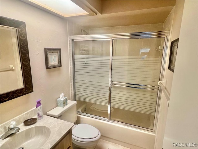 715 E Hartford St Unit 4A, Hernando, FL 34442 - bathroom with vanity, toilet, and combined bath / shower with glass door