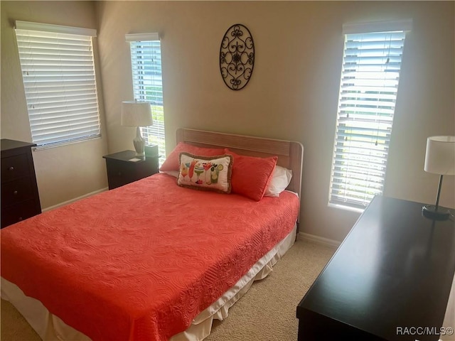715 E Hartford St Unit 4A, Hernando, FL 34442 - bedroom with carpet, baseboards, and multiple windows