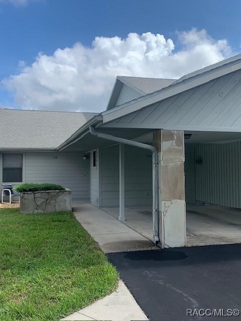 715 E Hartford St Unit 4A, Hernando, FL 34442 - entrance to property featuring a lawn and heating unit