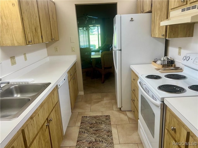 715 E Hartford St Unit 4A, Hernando, FL 34442 - kitchen with white appliances, under cabinet range hood, a sink, light countertops, and brown cabinetry