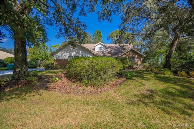 view of front of home with a front yard