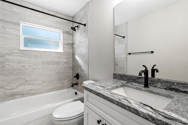 bathroom with toilet, shower / bathing tub combination, and vanity