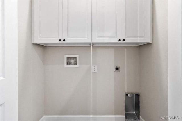 laundry room with cabinet space, washer hookup, and electric dryer hookup