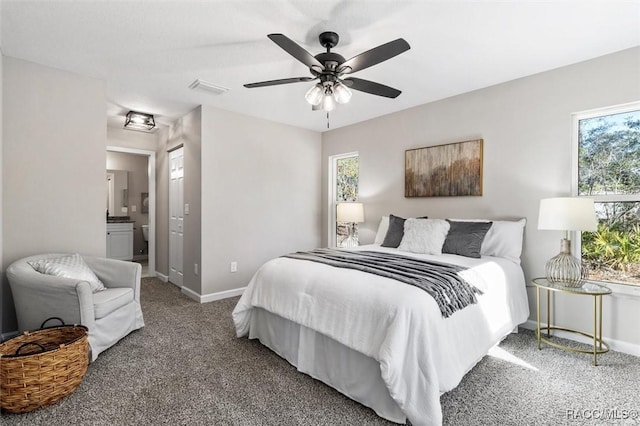 bedroom featuring ensuite bathroom, ceiling fan, visible vents, baseboards, and carpet