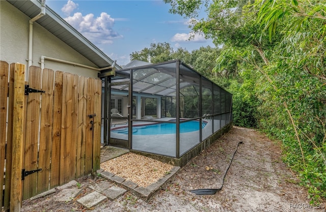 view of swimming pool with a lanai