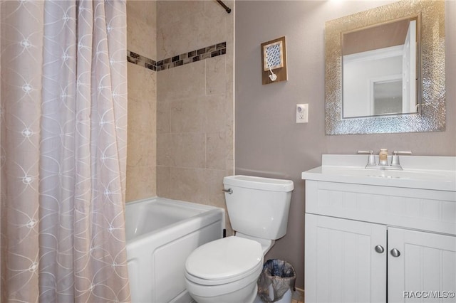 full bathroom with vanity, shower / bath combination with curtain, and toilet