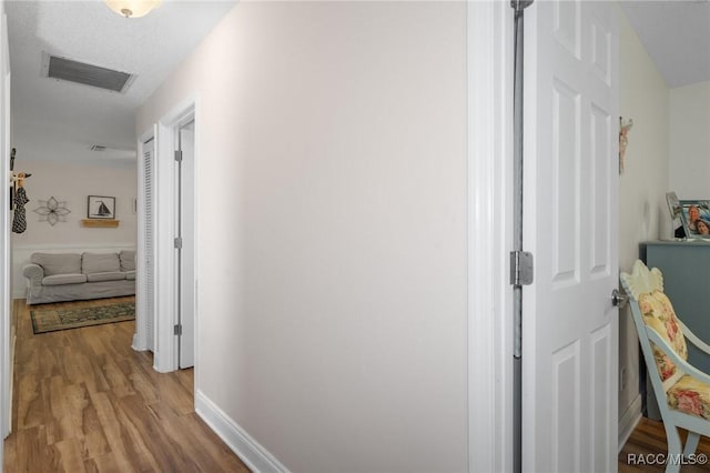 hall featuring light hardwood / wood-style flooring