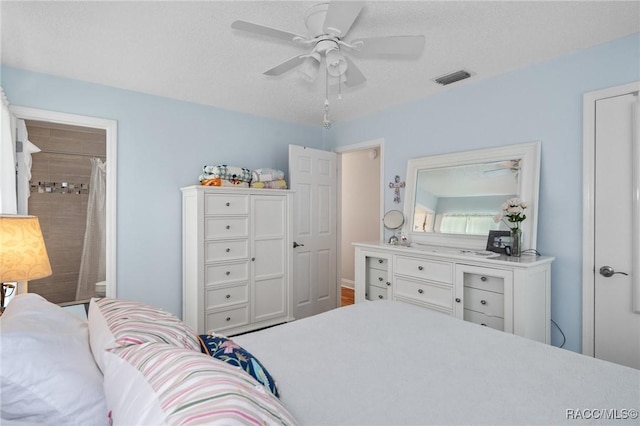 bedroom featuring a textured ceiling and ceiling fan