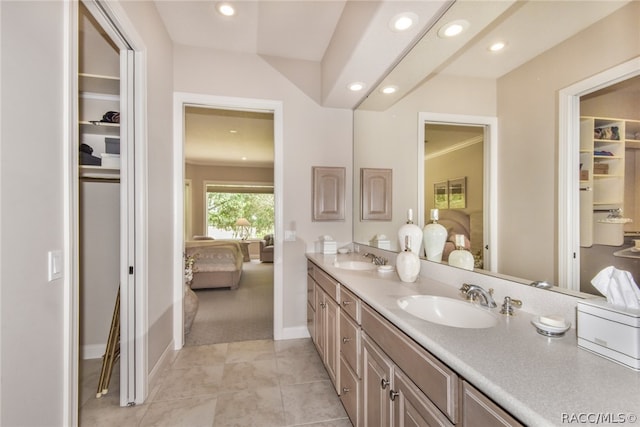 bathroom with tile patterned floors and vanity