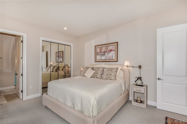 carpeted bedroom with a closet