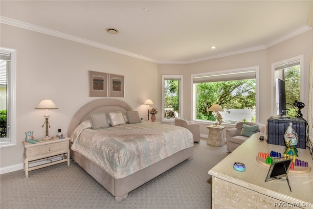 bedroom featuring carpet flooring, multiple windows, and ornamental molding