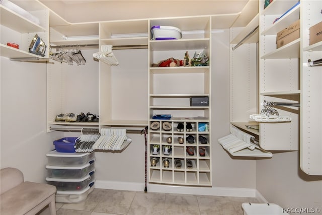 walk in closet featuring light tile patterned floors