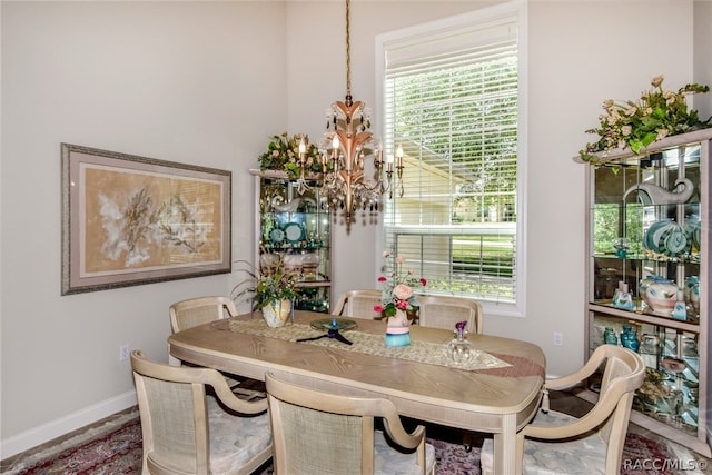 dining room featuring a wealth of natural light and a chandelier