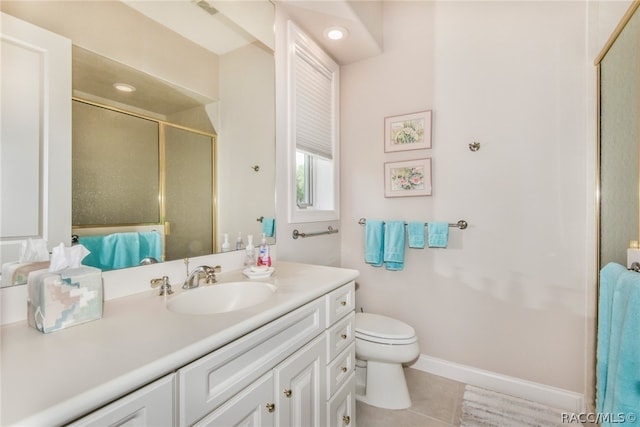 bathroom with tile patterned floors, vanity, toilet, and a shower with shower door