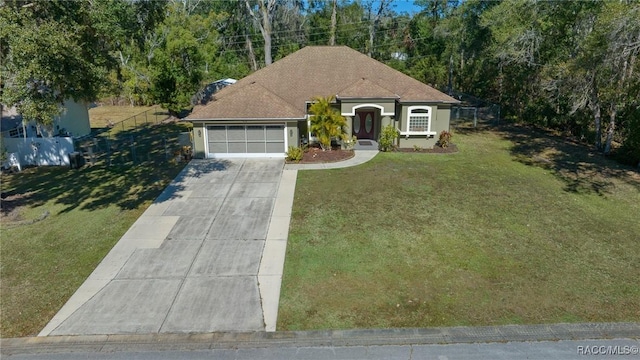 view of front of home with a garage and a front yard