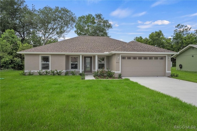 single story home with a front lawn and a garage