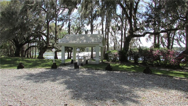 exterior space with a lawn and a gazebo