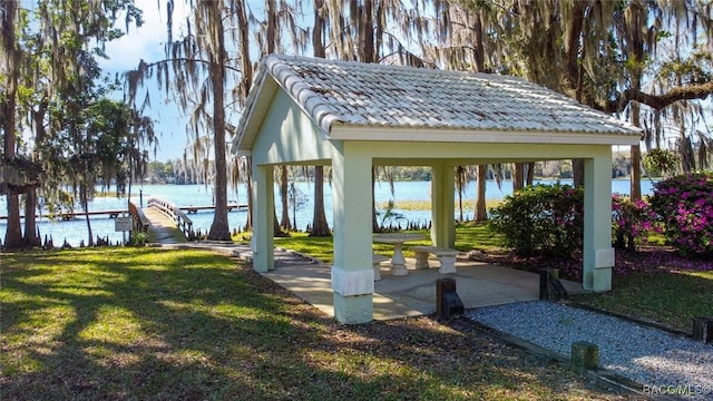 exterior space with a gazebo and a water view