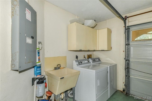 laundry room with cabinets, sink, washer and clothes dryer, and electric panel