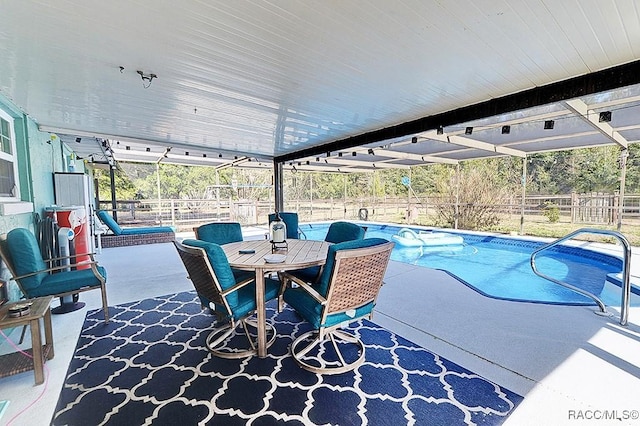 view of swimming pool with a patio area