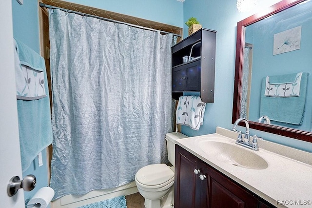 bathroom featuring vanity, a shower with shower curtain, and toilet