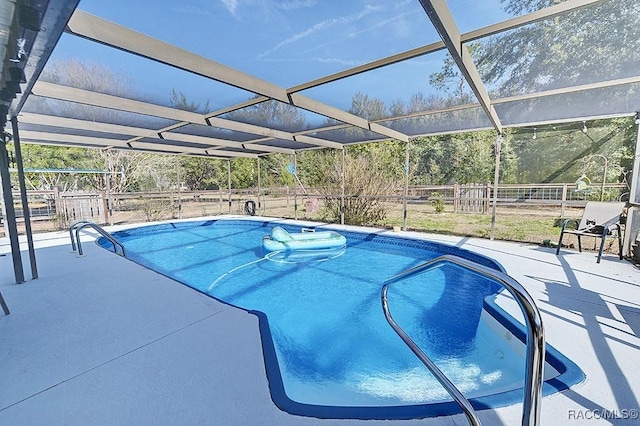 view of pool featuring a lanai and a patio area