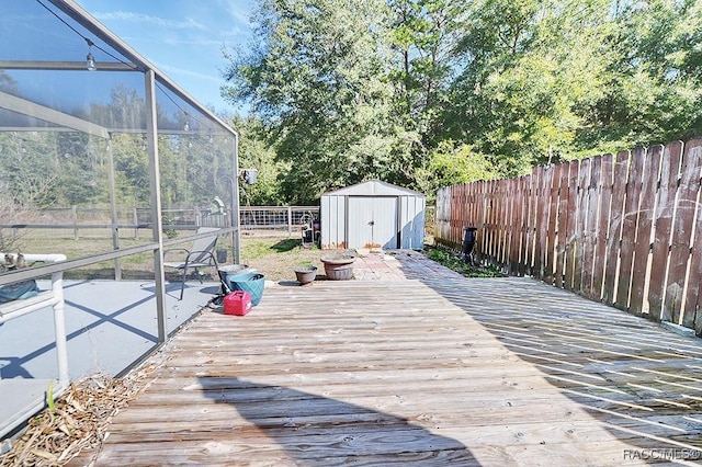 deck with a storage unit and glass enclosure