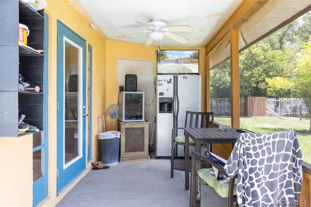 sunroom / solarium with ceiling fan and plenty of natural light