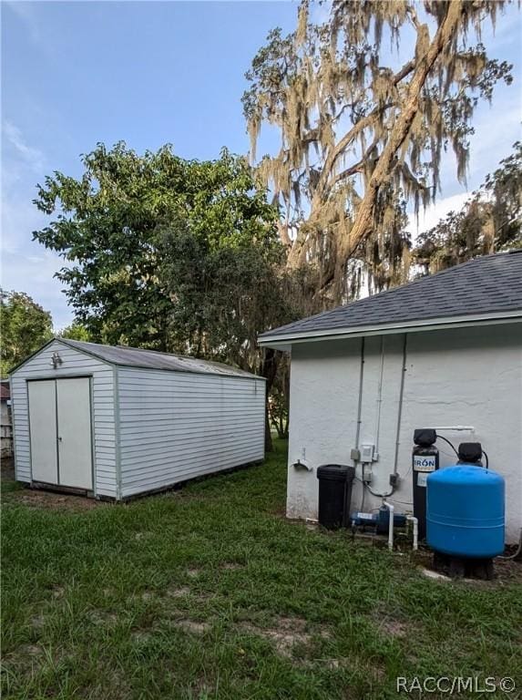 view of outbuilding with a yard