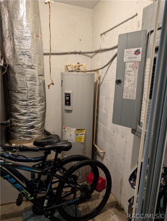 utility room featuring electric water heater