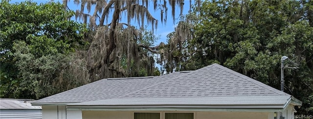 exterior details with a shingled roof