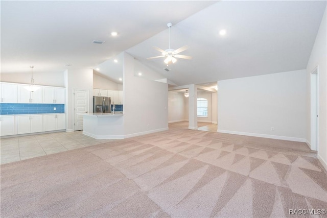 unfurnished living room featuring light colored carpet, ceiling fan, and lofted ceiling