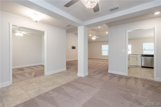 carpeted spare room with a wealth of natural light