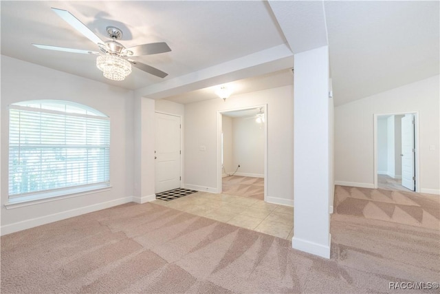 interior space with light carpet and ceiling fan