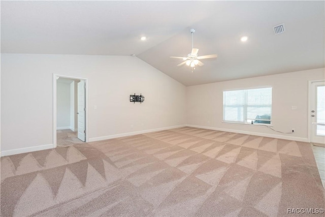 unfurnished room featuring ceiling fan, light colored carpet, and lofted ceiling