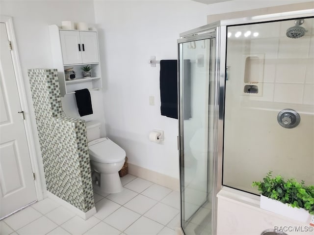 bathroom featuring tile patterned flooring, toilet, and an enclosed shower