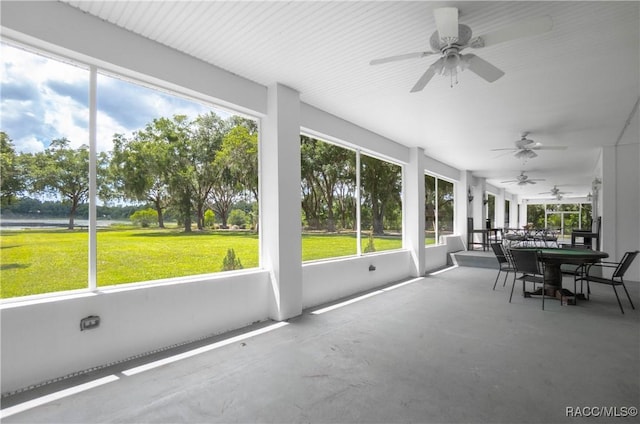 9093 E Pinehurst Ct, Inverness, FL 34450 - sunroom / solarium with ceiling fan, plenty of natural light, and outdoor dining area