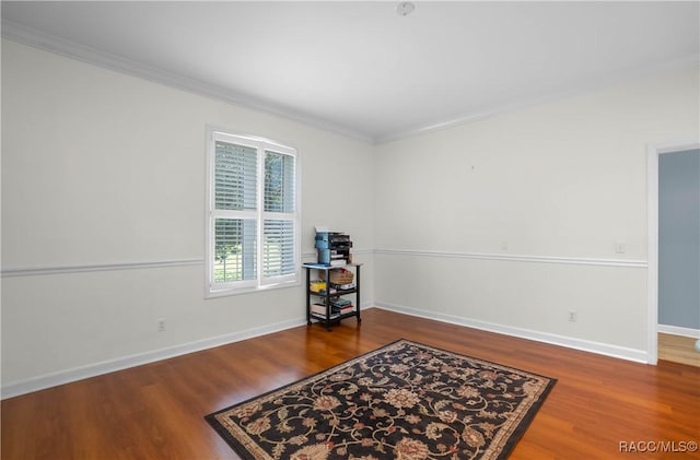 9093 E Pinehurst Ct, Inverness, FL 34450 - sitting room with wood finished floors and crown molding