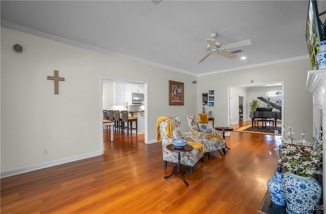 9093 E Pinehurst Ct, Inverness, FL 34450 - living room featuring wood finished floors, ceiling fan, crown molding, and recessed lighting