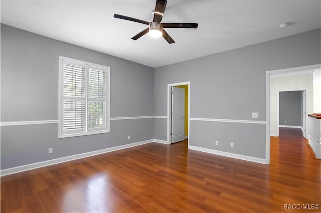 9093 E Pinehurst Ct, Inverness, FL 34450 - empty room featuring ceiling fan, wood finished floors, and a smoke detector