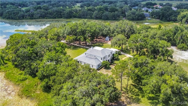 9093 E Pinehurst Ct, Inverness, FL 34450 - aerial view of property and surrounding area featuring a large body of water and a forest