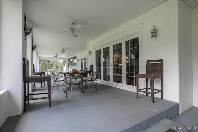 9093 E Pinehurst Ct, Inverness, FL 34450 - view of patio / terrace with ceiling fan, outdoor dining area, and french doors