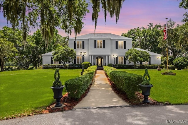 9093 E Pinehurst Ct, Inverness, FL 34450 - view of front of house featuring a front lawn