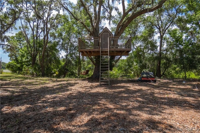 9093 E Pinehurst Ct, Inverness, FL 34450 - view of yard with a deck